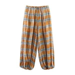 Plaid jogger pants with elastic drawstring waist and cuffed ankles on white background