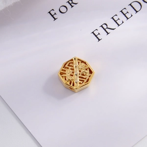 Macro shot of gold-plated S925 silver hexagonal bead with hollow bamboo leaf patterns
