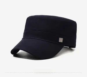 Side view of deep blue flat top military cap with square metal logo and stitch details
