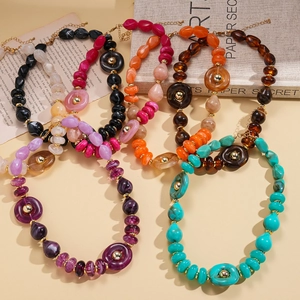 Multicolor acrylic beaded sweater necklace with irregular round beads and gold accents