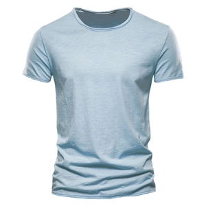 Close-up of light blue slub cotton t-shirt fabric showing rich texture and crew neck