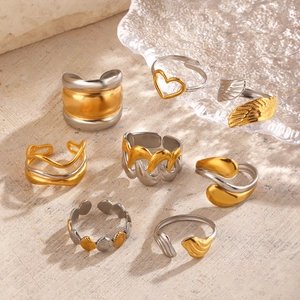 Bagues bicolores en acier inoxydable plaqué or 18 carats avec motifs cœur et ailes