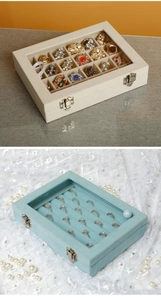 Detail view of 24-grid velvet jewelry box with transparent lid and metal safety lock