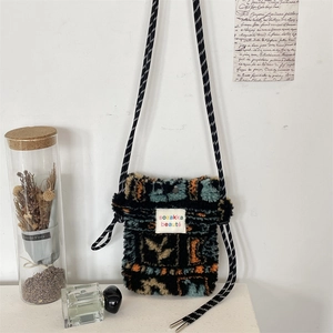 Close-up of plush crossbody bag featuring colorful lamb wool texture and Zakka fabric label