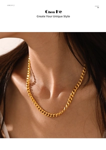 Detailed close-up of a polished gold-plated Cuban curb chain necklace on a model's neck