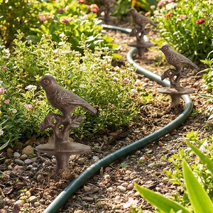 Vintage cast iron bird garden hose holder and decorative stake with bronze finish