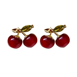 Elegant cherry earrings with red resin beads and green crystal leaves on gold stems