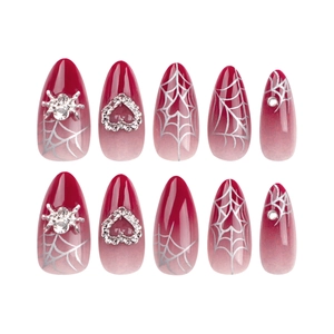 Red gradient press-on nails with silver spider and heart rhinestone almond design