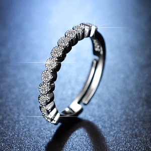 Macro side view of silver S925 sterling silver ring featuring a row of sparkling zircons