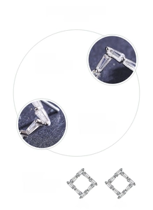 Macro detail of geometric S925 silver stud earrings with hand-set 5A cubic zirconia