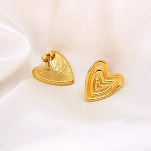 Exotic vintage heart-shaped stud earrings in polished gold stainless steel finish