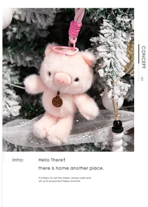 Detail of pink plush pig keychain with braided lanyard and festive holiday background