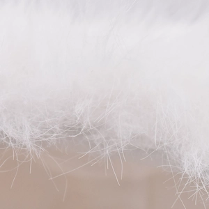 Macro shot of ultra-soft white faux rabbit fur texture on this warm winter baseball cap