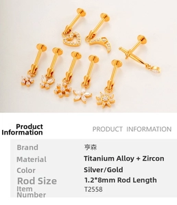 Detail of 1.2mm titanium internally threaded labret studs with various gold charms