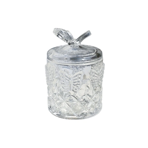Transparent butterfly glass storage jar with embossed pattern and crystal lid handle