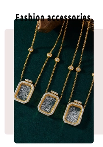 Detailed shot of three gold perfume bottle pendants with sparkling stones on velvet