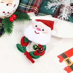 Close-up of plush Santa Claus scrunchie with red and green bells for Christmas