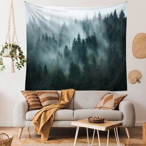 Detailed close-up of misty forest tapestry hung above a sofa in a modern Nordic living room