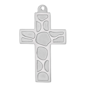 Macro detail of silver titanium steel cross pendant with embossed irregular pattern
