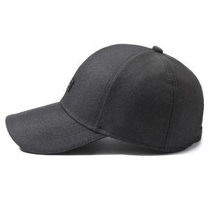 Side view of dark grey twill cotton baseball cap with curved brim and logo patch