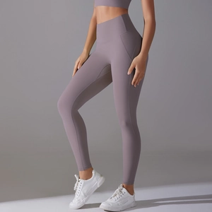 Detail of high-waist seamless yoga leggings in grey-purple with tummy control feature