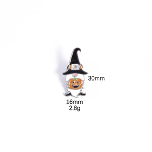 Detail showing a 30mm Halloween gnome enamel pin with wizard hat and pumpkin lamp