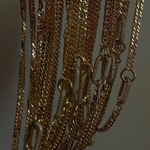 Gold-toned geometric choker set with cuban link and pavé paperclip chain necklaces