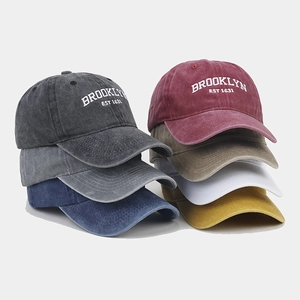 Collection of washed cotton baseball caps in multiple colors with Brooklyn embroidery