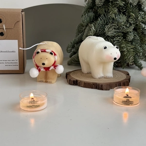 Polar bear candles with red scarf and gift packaging for Christmas home decor