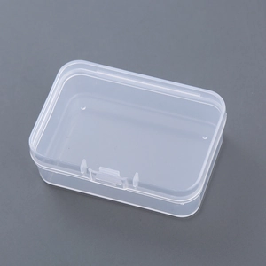 Macro shot of a rectangular clear plastic storage box with a secure flip-top lid