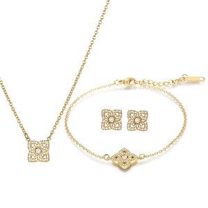 Elegant gold titanium steel clover jewelry set with sparkling diamonds in a 3-piece collection