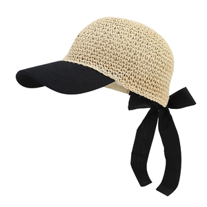Chic straw weave baseball cap with black brim and elegant oversized bow ribbon detail