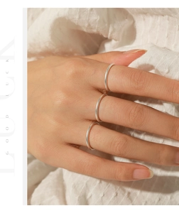 Detailed close-up of a three-piece s999 sterling silver minimalist ring set for women