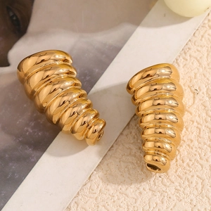 Macro shot of 18K gold plated stainless steel earrings with unique spiral cone design