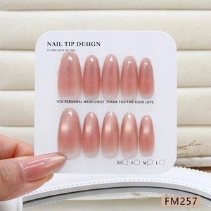 Pink cat eye handmade press-on nails almond shape with shimmering blush gradient finish