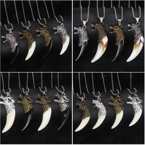 Men's stainless steel wolf tooth pendant necklaces in various colors and metallic finishes