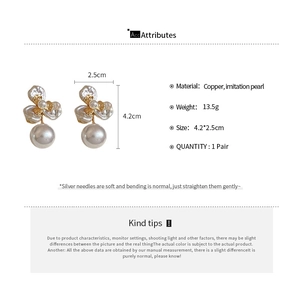 Detailed size and material specifications for gold floral pearl drop earrings