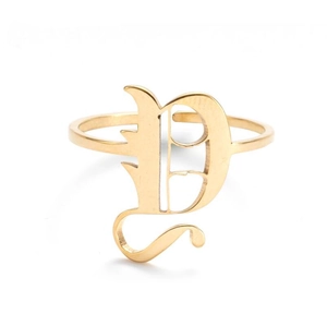 Macro shot of gold gothic initial D ring featuring vintage engraved flower patterns