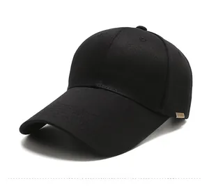 Detail view of the black cotton canvas baseball cap with bronze metal sport emblem