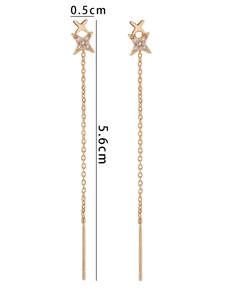 Detailed view of gold cross star earrings with zircon inlay and 5.6cm length dimension