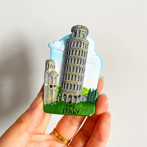 Handheld view showing detailed 3D resin Pisa Italy souvenir fridge magnet with Leaning Tower
