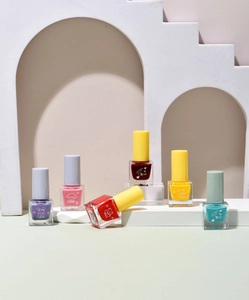 Close-up of six colorful water-based peel-off nail polishes with cute animal labels