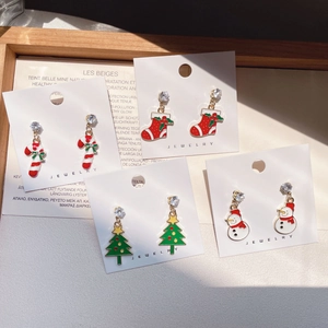 Christmas stud earring set featuring candy cane, sock, tree and snowman holiday designs