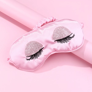 Pink silk-like sleep mask with sequin eyeshadow and long eyelash embroidery detail