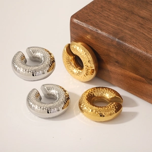 C-shaped textured 18k gold and silver stainless steel clip-on earrings with hammered finish