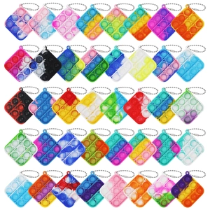 Rainbow mini Pop It keychain set with 3x3 silicone bubble fidget toys in various colors