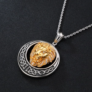 Detailed close-up of a hip-hop lion head pendant with gold plating and cubic zirconia
