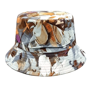 Detailed view of heavy canvas bucket hat with abstract oil painting print and stitching