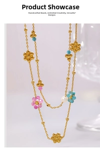 Detailed close-up of a floral beaded necklace with apatite stones and white pearl
