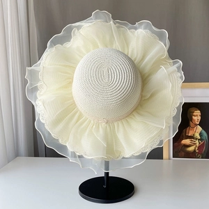 Elegant cream straw sun hat with large pleated lace brim for beach and summer vacations